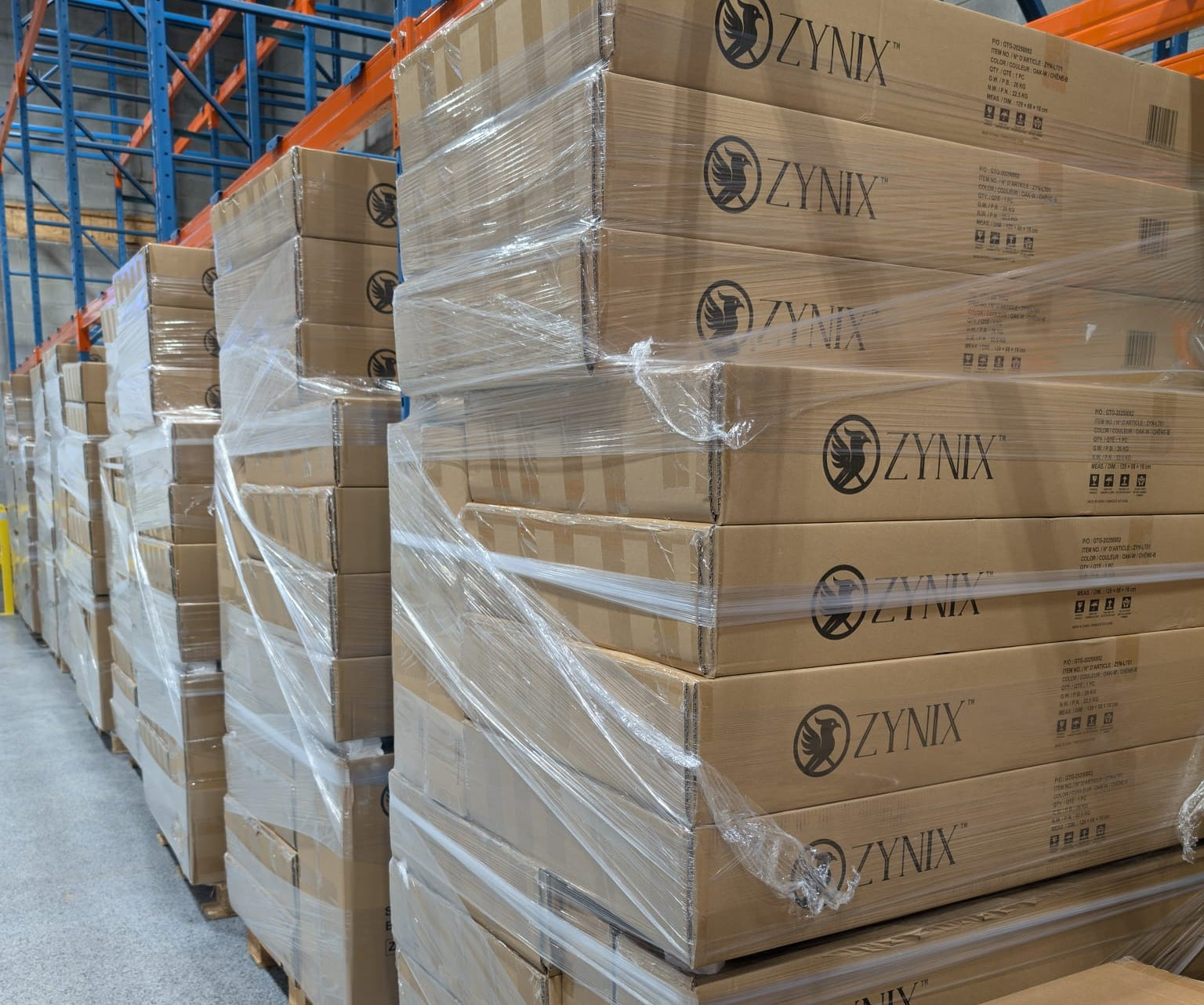 Stacks of Zynix branded boxes in a warehouse setting