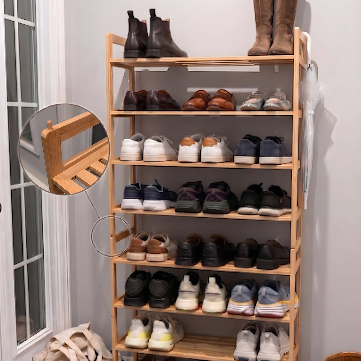 A tall wooden 8-shelf shoe rack filled with various shoes, boots, and sneakers, set in a home entryway next to a glass door with a circular inset showing the slatted shelf detail.
